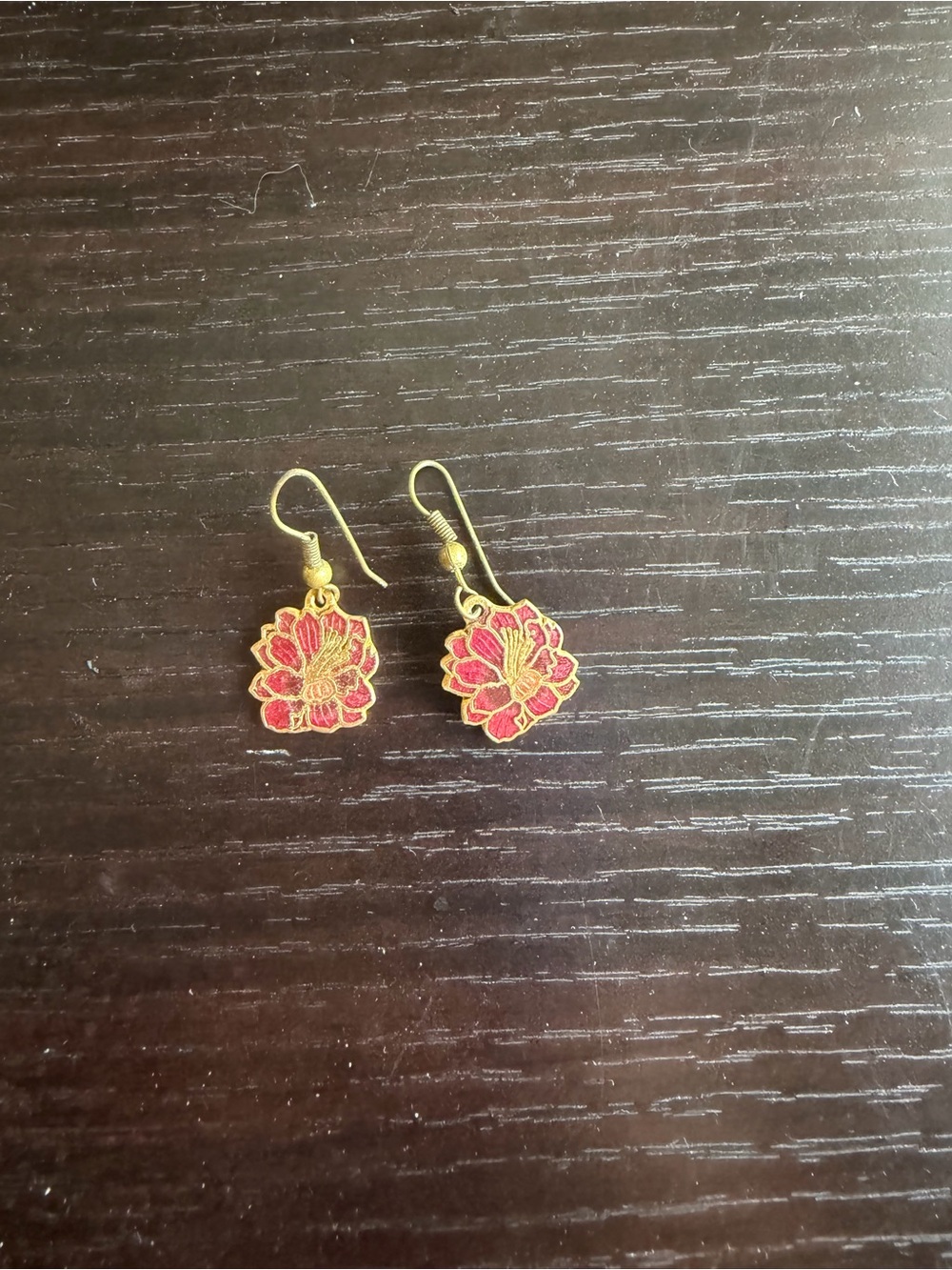 Vintage drop earrings featuring an enamel lotus design